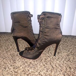 Cute stiletto heel olive colored tie up boots.